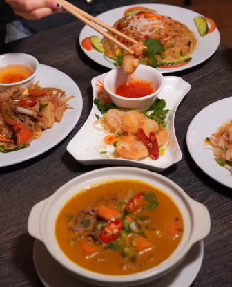 Tre Viet dishes being shared at the table